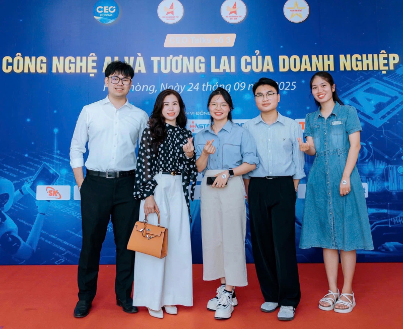A group of people posing for a photo

Description automatically generated